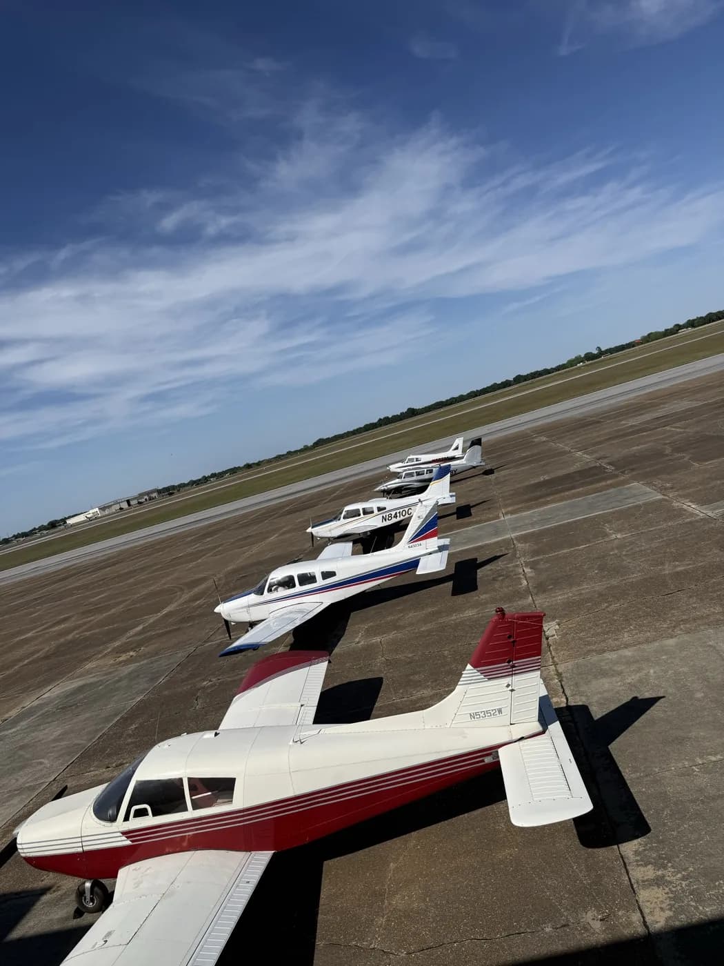 Three Piper aircraft lined up on the ramp at golden hour at Ozark-Blackwell Airport (71J), Ozark AL